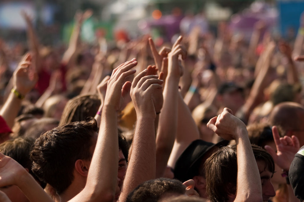 Crowd with hands in the air at concert